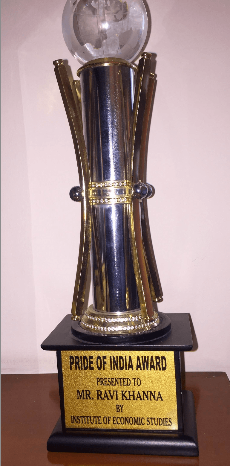 Pride of India Award trophy presented to Mr. Ravi Khanna by Institute of Economic Studies
